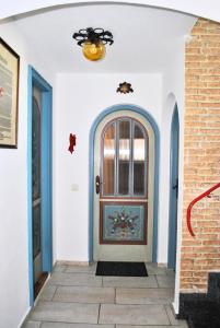 a front door of a house with blue and white walls at Ferienwohnung Eschental in Eschenlohe
