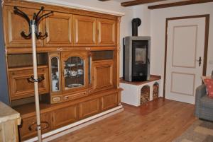 a large wooden cabinet with a tv in a living room at Ferienwohnung Eschental in Eschenlohe
