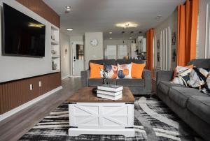 a living room with a couch and a coffee table at Raleigh With Daylor in Raleigh