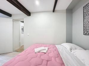 En eller flere senge i et værelse på Appartement tout neuf 4 pers N6