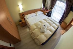 Uma cama ou camas num quarto em Best Western Hotel Class Lamezia