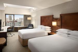 Postel nebo postele na pokoji v ubytování Renaissance Seattle Hotel