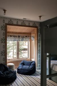 a bedroom with a window and a bed and a bed at Luxury Lakefront 5 Br Home Hot Tub Arcade in Truckee