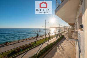 a view of the ocean from a building at Blue Wave Apartment in Calonge