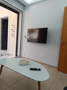 TV a/nebo společenská místnost v ubytování Μαρία 4 + 19 fotografií