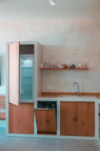 a kitchen with a sink and a counter at Escape by Form Apartament 4 in Dhërmi +43 photos