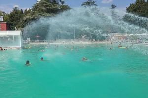 a group of people in the water in a fountain at L'archetto nel cuore Viterbese in Viterbo