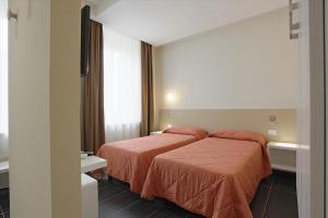 Posteľ alebo postele v izbe v ubytovaní Hotel Agrigento Home