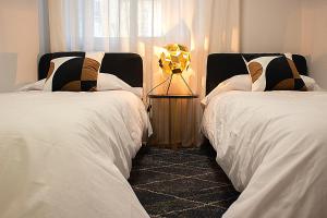 Postel nebo postele na pokoji v ubytování Golden Home