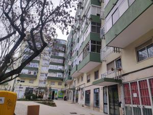 an empty street in front of an apartment building at Lisbon spacious T2 in Damaia, Lisbon in Amadora