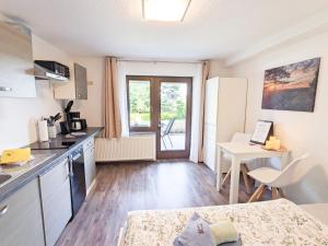 Kuchyň nebo kuchyňský kout v ubytování B1 - Urlaubsmagie - Einzimmerwohnung direkt am Wanderweg + 25 fotografií