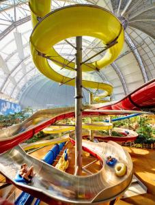 a water park with a bunch of water slides at Tropical Islands in Krausnick