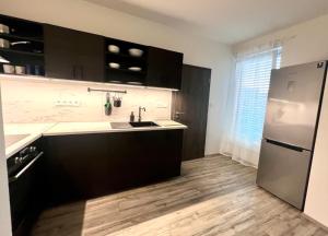 Kuchyň nebo kuchyňský kout v ubytování Apartmány Chodské námésti