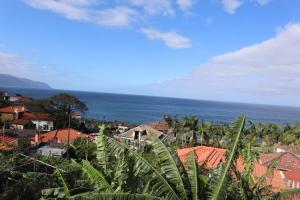 a view of a town with the ocean in the background at Casa do Tio Albino II, By OP in Ponta Delgada +7 photos
