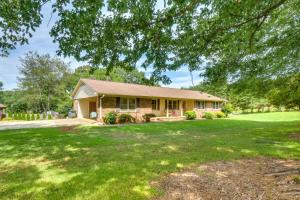 a house with a large lawn in front of it at West Union Home with Saltwater Pool on 2 Acres! in Walhalla