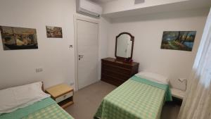 Postel nebo postele na pokoji v ubytování Residenza del Sole