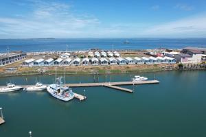 an aerial view of a marina with boats in the water at Westport Marina Cottages in Westport