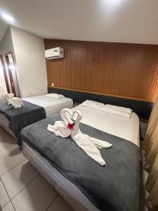 Ένα ή περισσότερα κρεβάτια σε δωμάτιο στο Nannai Beira Mar, Flat Duplex em Muro Alto - Porto de Galinhas