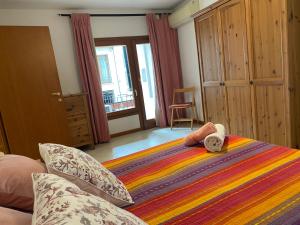 A bed or beds in a room at Ali