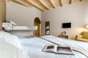 Postel nebo postele na pokoji v ubytování Hotel Nagusi