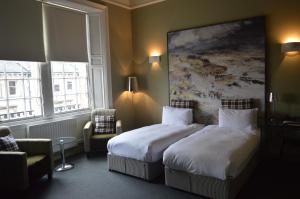 Postel nebo postele na pokoji v ubytování B+B Edinburgh