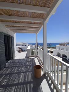a balcony with a view of the ocean at Tzitziki in Piso Livadi