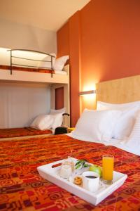 Postel nebo postele na pokoji v ubytování Kronos Hotel