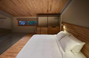 Una cama o camas en una habitación de 天井 樹 villa 包棟民宿 Atreeium villa