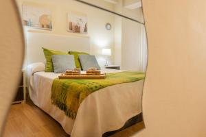 A bed or beds in a room at Apartamento Centro Santiago