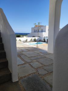 a view from the hallway of a house with stairs at Tzitziki in Piso Livadi