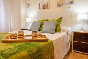 A bed or beds in a room at Apartamento Centro Santiago