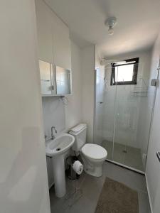 a bathroom with a toilet and a sink and a shower at TrevizZo Catedral da Sé in Sao Paulo