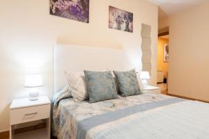 A bed or beds in a room at Apartamento Centro Santiago