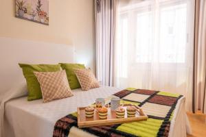 A bed or beds in a room at Apartamento Centro Santiago
