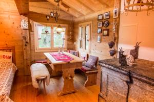 a wooden room with a wooden table in a cabin at Untere Schweibe in Riederalp
