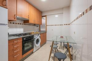 A kitchen or kitchenette at Apartamento Centro Santiago