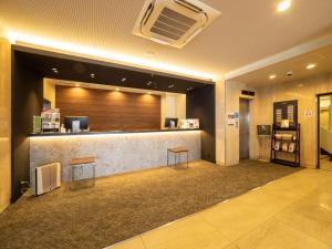 a lobby with a bar with two stools in it at Kusatsu Daiichi Hotel - Vacation STAY 99281v in Kusatsu