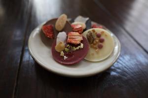 a plate of food on a wooden table at Bij Joseph in Den Bosch