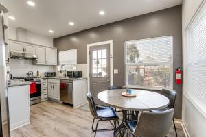 a kitchen with a table and chairs in a room at Walk to Crab Cove Beach Alameda Home with Game Room in Alameda