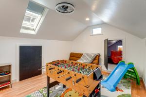 a play room with a foosball table and a slide at Walk to Crab Cove Beach Alameda Home with Game Room in Alameda