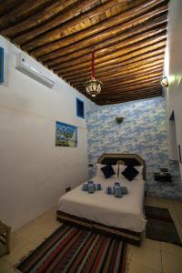 Postel nebo postele na pokoji v ubytování Riad bab merzouga