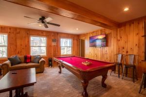 a living room with a pool table in it at The Tee House in Beech Mountain