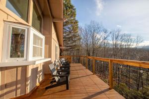 a balcony with benches on the side of a house at The Tee House in Beech Mountain
