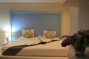 Postel nebo postele na pokoji v ubytování Phuket Racha Kata Homestay