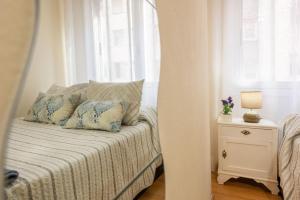 A bed or beds in a room at Apartamento Centro Santiago