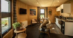 a kitchen and living room in a tiny house at Silo House in Lake Tekapo