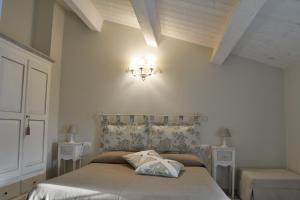 A bed or beds in a room at Il Fienile di Assisi