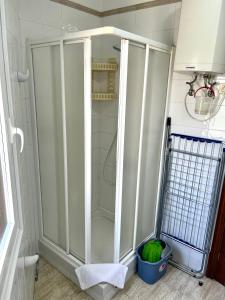 a shower with a glass door in a bathroom at Apartamentos Edalmar in Frontera