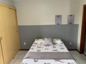 En eller flere senge i et værelse på Studio completo a 200m do shopping Iguatemi