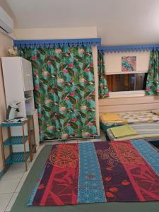 Letto o letti in una camera di STUDIO FONCTIONNEL dans HOTEL CARAYOU SPA PISCINES